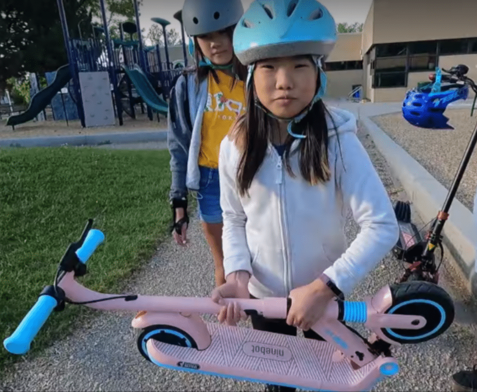 Maggie-Picking-Up-The-Segway-Ninebot-Zing-E8
