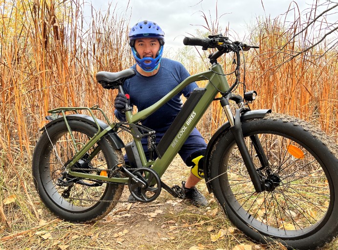 Bee-Cool-Adventurer-Fat-Tire-Ebike-with-Full-Suspension-in-Army-Green-in-the-bushes