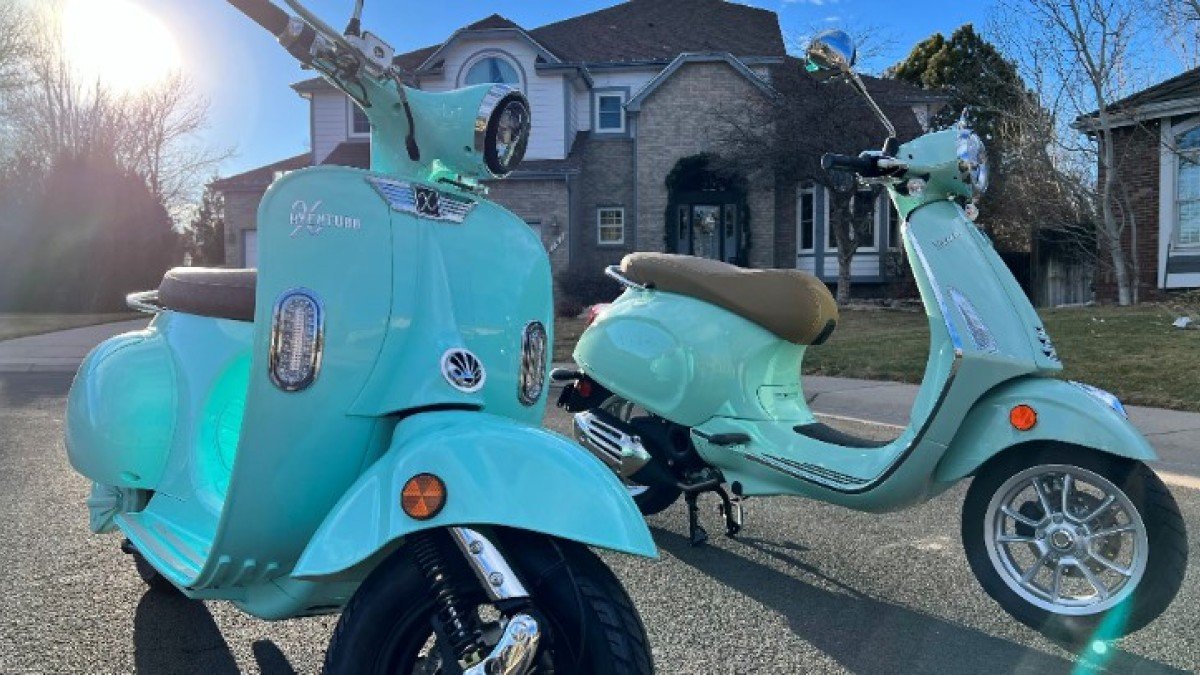 2023 Aventura X Aventura-X-Electric-Scooter-next-to-a-Vespa-50cc-Primavera-2
