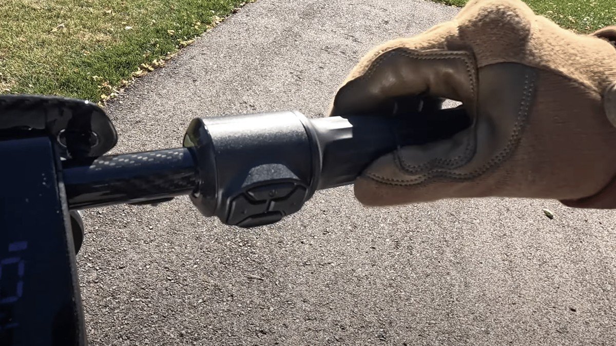 2024 NIU KQi Air Gloved Hand On Handlebar