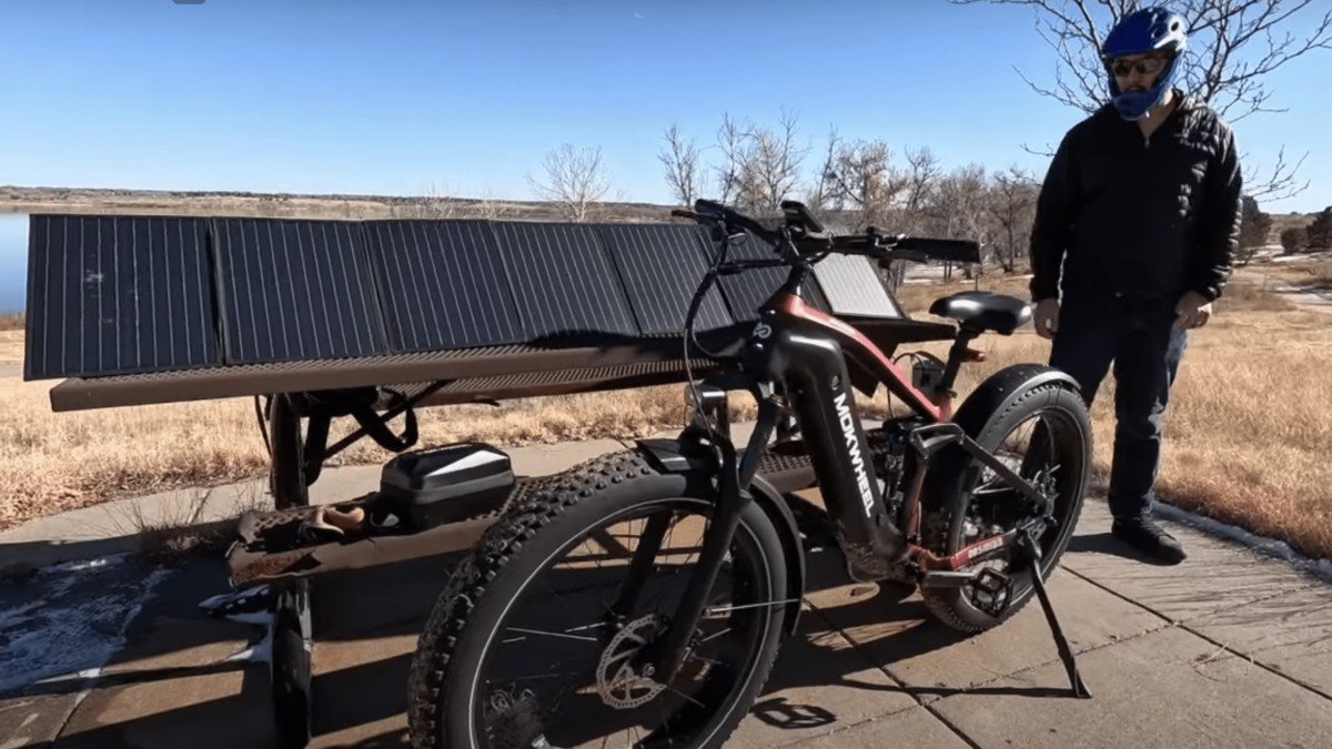 2024 Mokwheel Obsidian ebike parked by solar panels