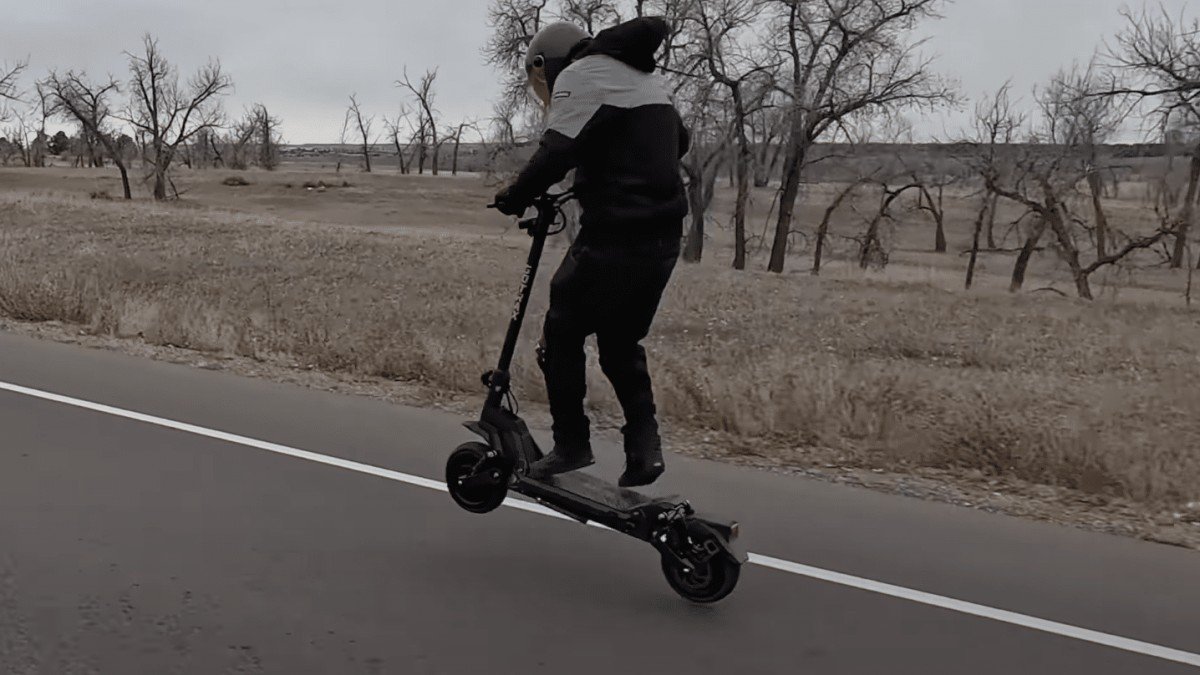 2023 Gotrax GX3 man riding wheelie