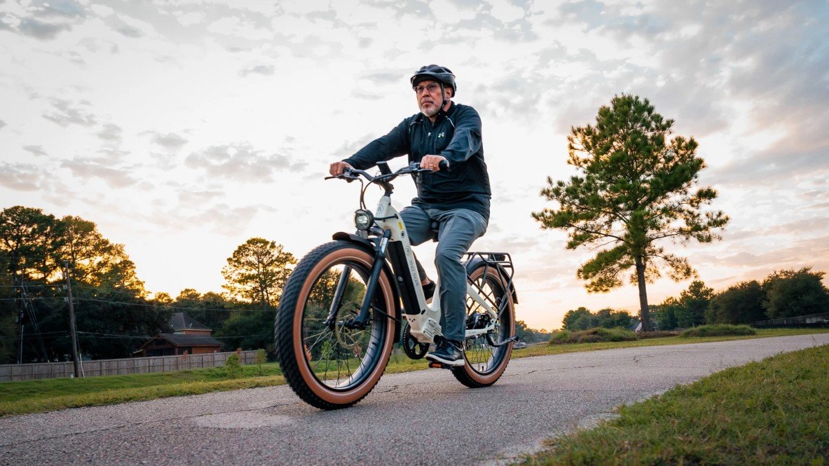 2025 AIMA Big Sur man riding white bike