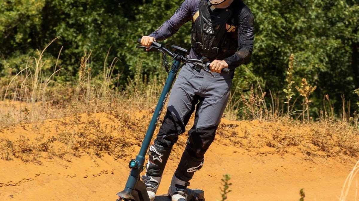 2023 Gotrax GX3 man riding dirt path